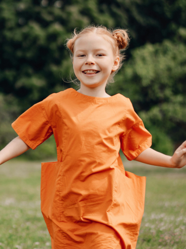 Child running in a field