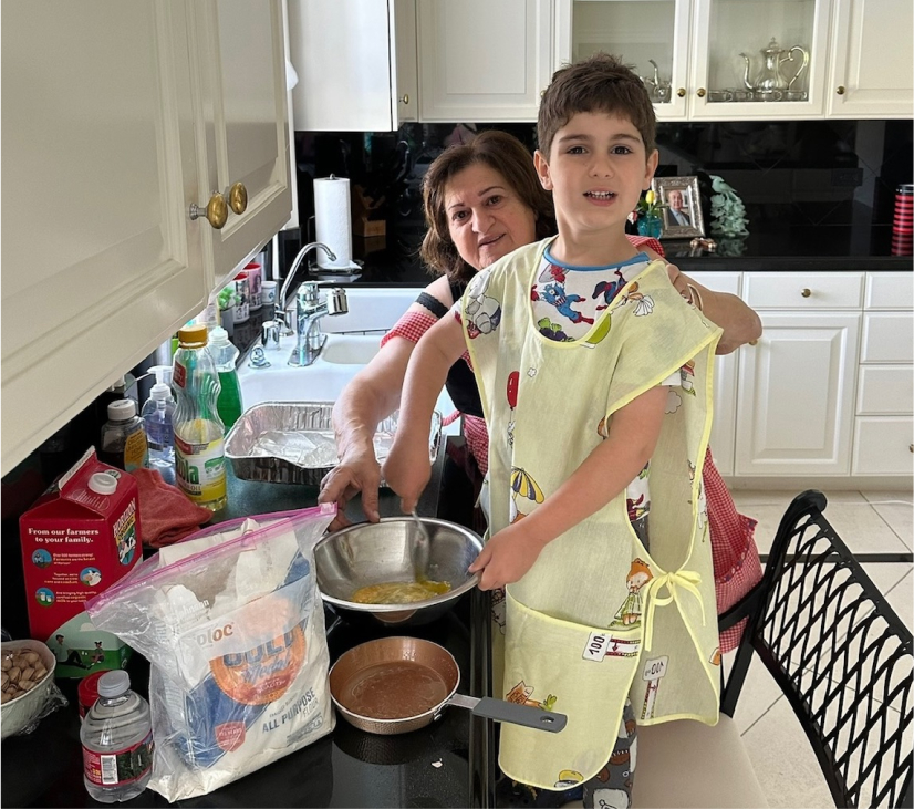 Grandchild cooking recipe with grandparent