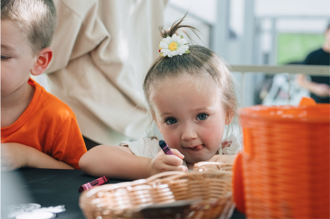 Child coloring with crayon